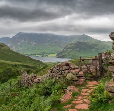 A view of a stone wall and gate looking towards Crummock Water in the Lake District ©Mick Howard
