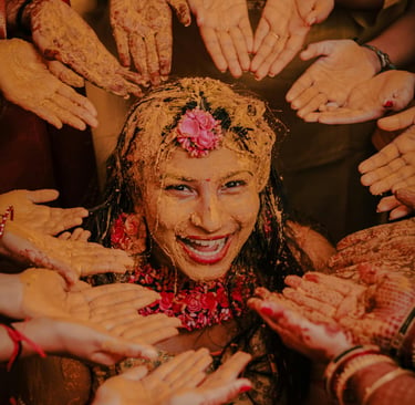 Indian Haldi ceremony with turmeric paste applied to skin, traditional skincare ritual before wellni