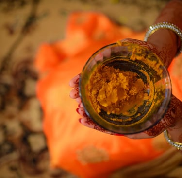 DIY turmeric and besan face pack with rose water in ceramic bowl, natural Indian skincare treatment
