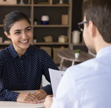 International nurse smiling at interview.