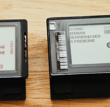 two black and white tags on a wooden table