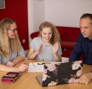 Happy supportive parents that are satisfied with the succes that their child is making