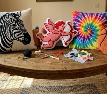a table with a tufted pillows on it