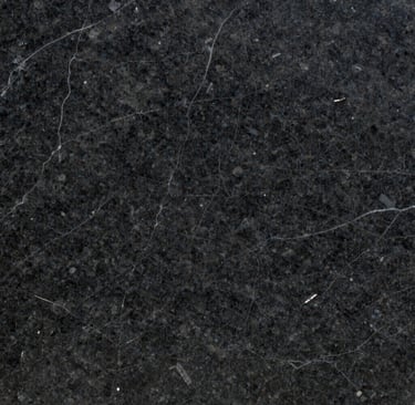 Smooth quartz slabs with warm beige hues and delicate flecks, ready for residential countertops.