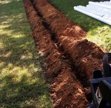 Professional buried downspout installation in Atlanta to prevent erosion and protect home from water