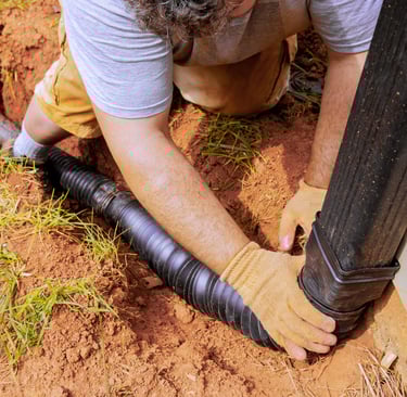 Professional buried downspout installation in Atlanta to prevent erosion and protect home foundation