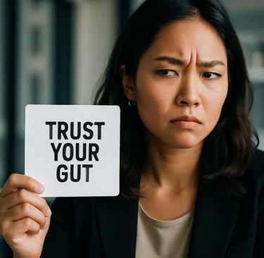 a woman holding a sign that says trust your gut