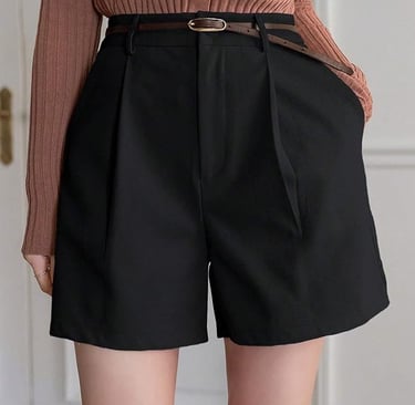 Black shorts with a brown belt to complete the outfit