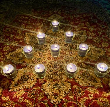 Ten candles on a rug.