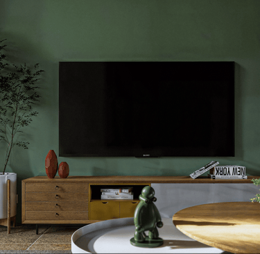 a living room with a tv and a large screen tv