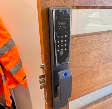 Professional locksmith installing a IPM016 smart door lock on a wooden door in Melbourne – Ipsum