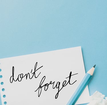 a notepad with a pencil and a pencil on a blue background