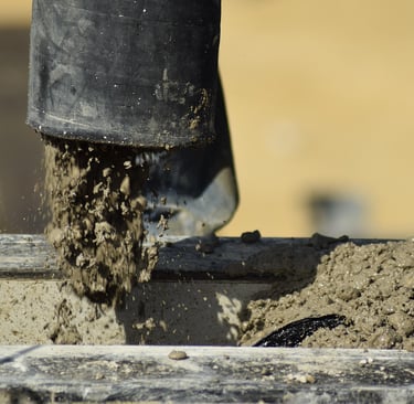  a cement mixer to make a concrete block