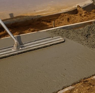 a person is using a concrete leveling to work on fresh concrete