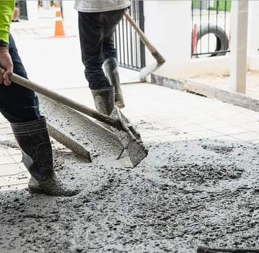 men pouring fresh concrete on the sidewalk