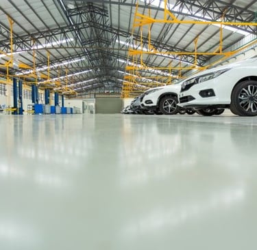 a car parked in an epoxy flooring showroom