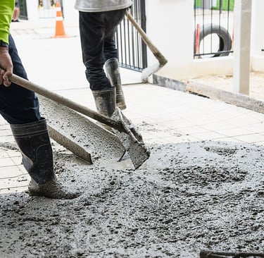 men mixing and pouring concrete