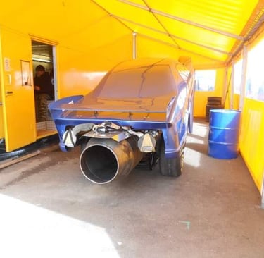 Yellow lorry awning with curtains made for fire force racing team