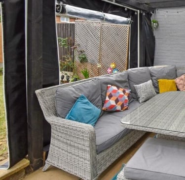 PVCFAB Aluminium pergola with heavy duty roll up all weather PVC covers and curtains in black