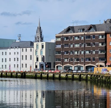 The Premier Inn entrance is below the spire