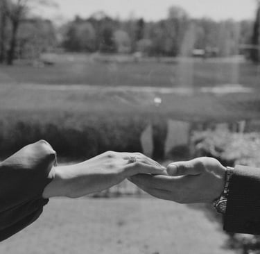 A man taking the hand of a woman