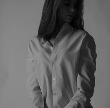 a woman in a white shirt and black pants