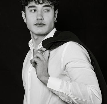 a man in a suit jacket and a white shirt