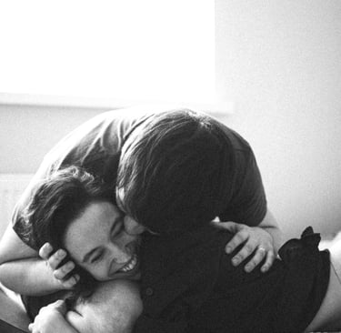 a man and woman who met on piano piano, kissing on a bed