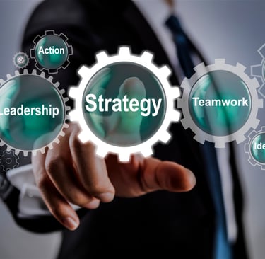 a man in a suit and tie pointing to a gear image with the word strategy.
