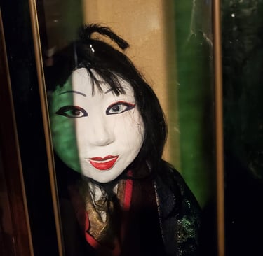 Kabuki style doll face on display in Weird Museum for Boys and Girls