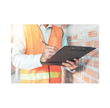 “Person wearing a reflective vest writing on a clipboard during a home inspection visit.”