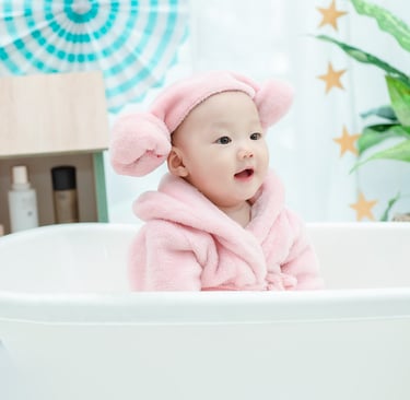 Essential baby bath products including bathtub, gentle soap, and soft towels.