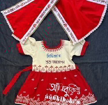 a baby girl's dress with a red and white dress