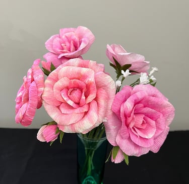 roses in various shades of pink hand-made from tinted crepe paper