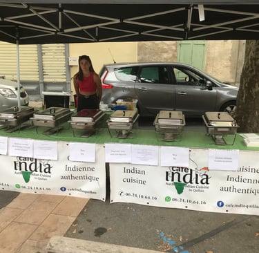 A Cafe India street food stall serving authentic Indian cuisine from silver buffet warmers Quillan.