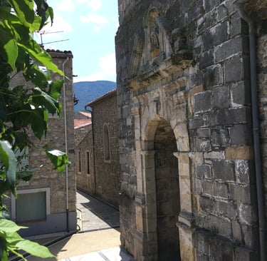 Bedroom with balcony and church view in Quillan holiday home