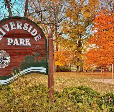 Rivermont's Riverside Park main entrance sign in autumn