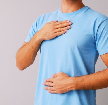 a man with a chest pain holding his chest
