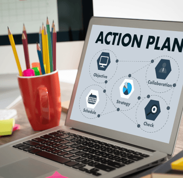 a laptop computer screen showing a laptop with a business action plan on it