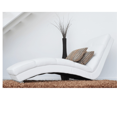 a white leather reclining chair with a vase with a vase with a vase on