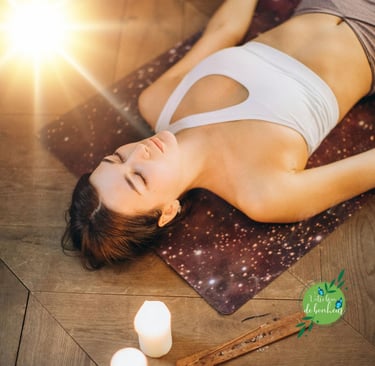 a woman is laying on a yoga mat