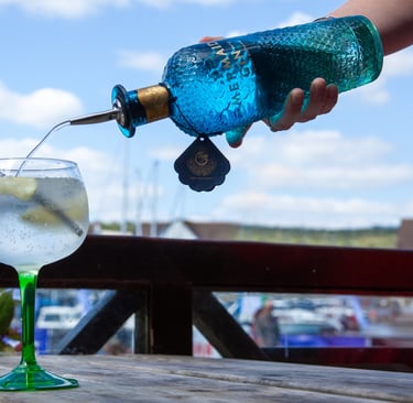 Mermaid Gin being pored into a glass