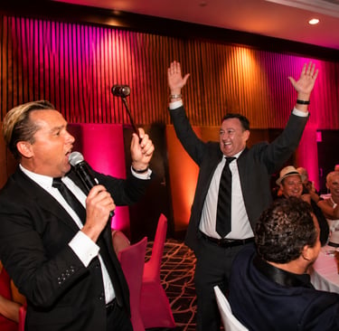 Professional charity fundraising auctioneer and gala emcee Craig Rosevear closing a dynamic bid at a