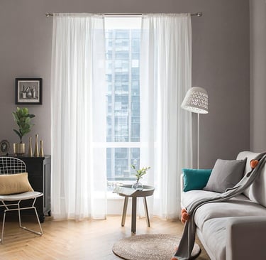 a living room with a couch and a chair