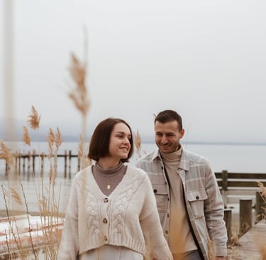 a man and woman walking down a path