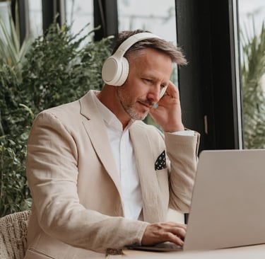 Business Man wearing noise cancelling headphones
