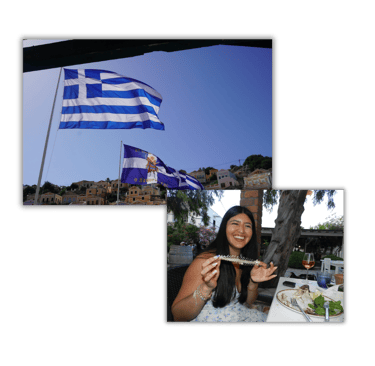 a woman is smiling and holding a plate of food. Greece Flag when visiting different places to travel