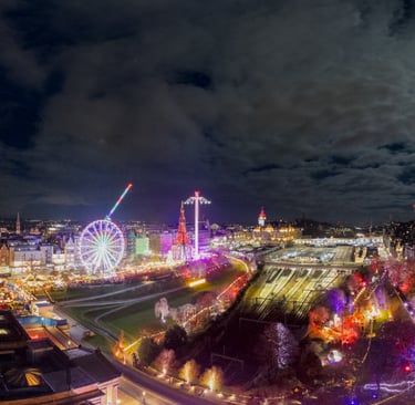 Edinburgh christmas market showing full moon over wavery station and the edinburgh market