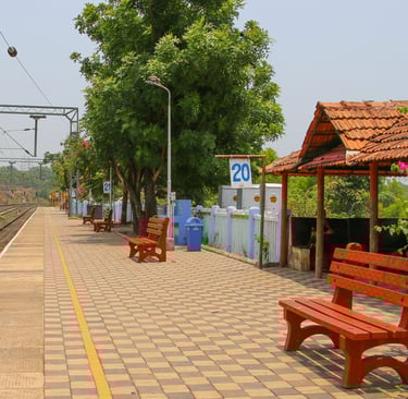 a bench with benches in front of a thivim train station