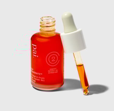 Pai Skincare Rosehip BioRegenerate Face Oil in an amber glass bottle, deep orange antioxidant-rich